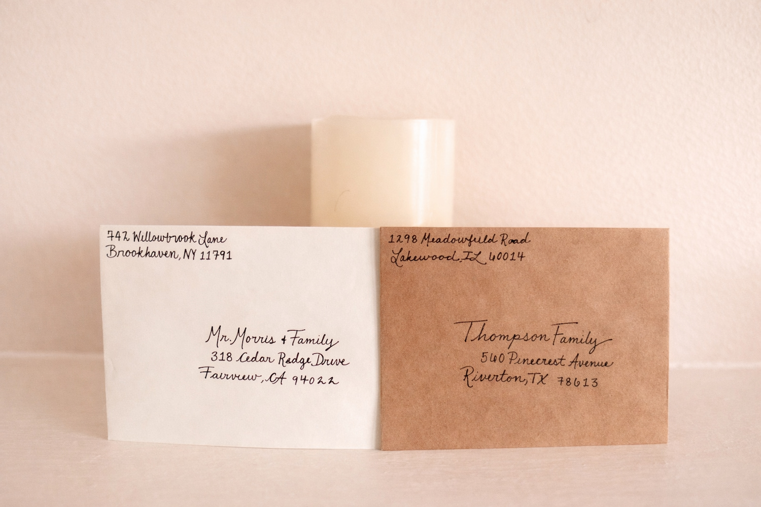 Handwritten envelopes with warm candlelight
